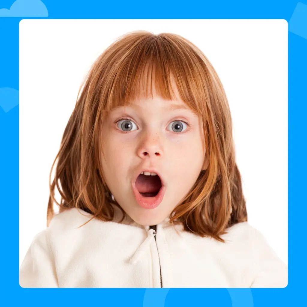 Photo of a child looking surprised with her mouth open.