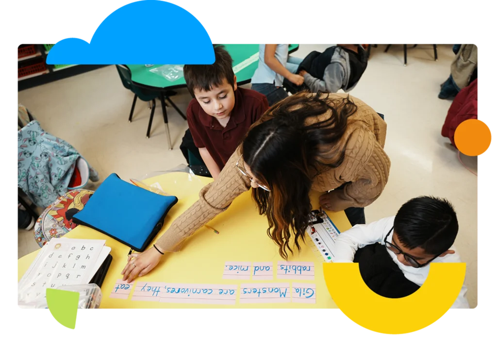 Paraprofessional doing vocabulary exercise with students.