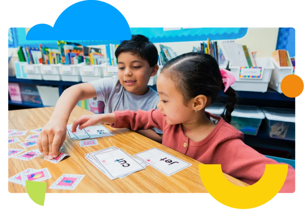 Two students doing reading comprehension exercise with flash cards.