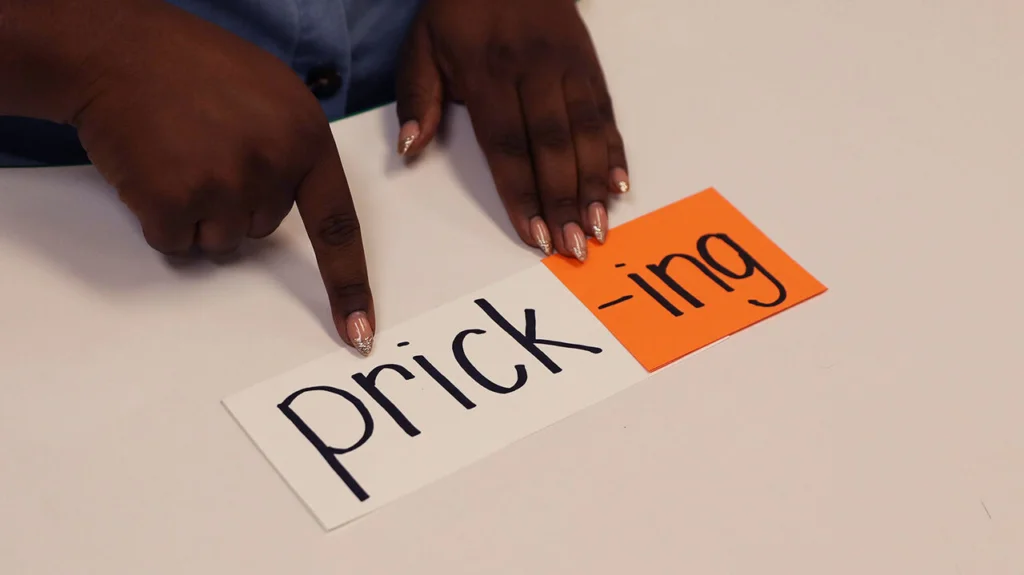 The word "pricking" as an illustration of the '-ing' suffix.