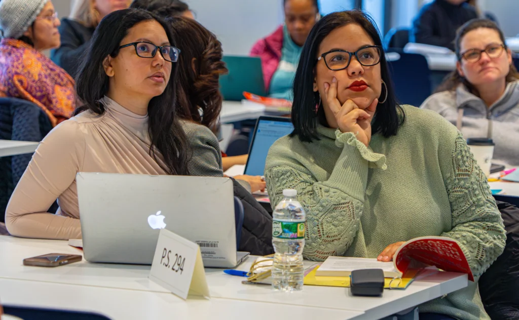 two teachers in a professional development session on teaching reading with English learners